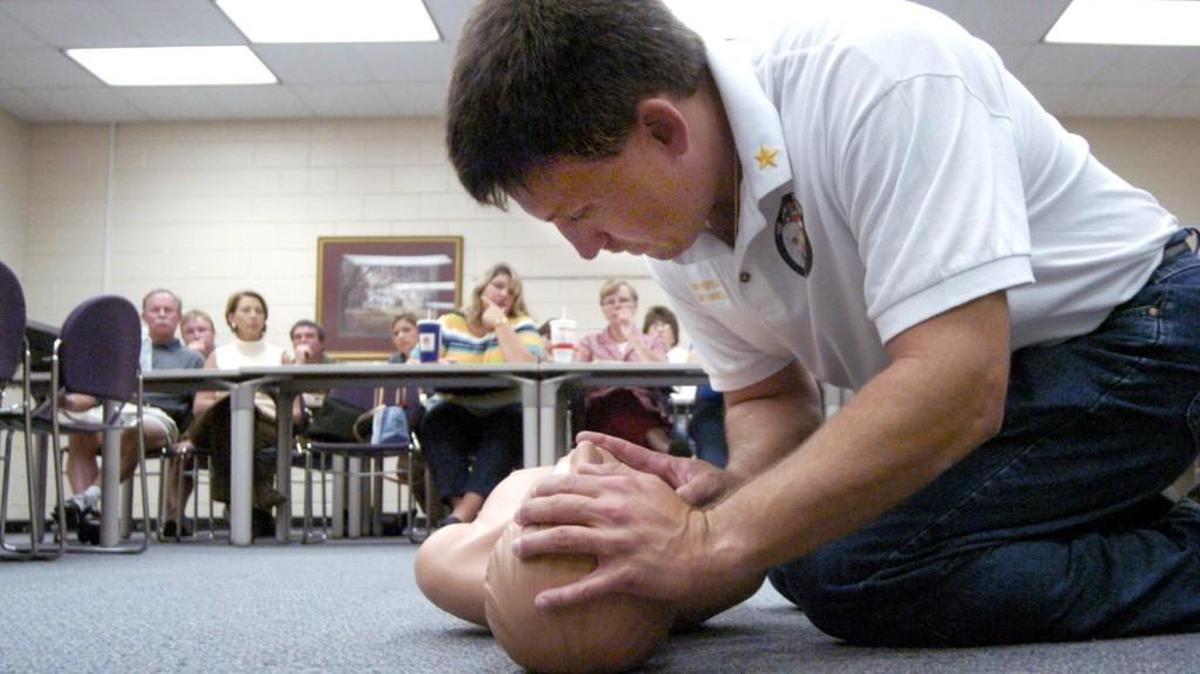Steve Rodgers demonstrates CPR during a Oct. 6, 2004, training session for the Houston County School system.
