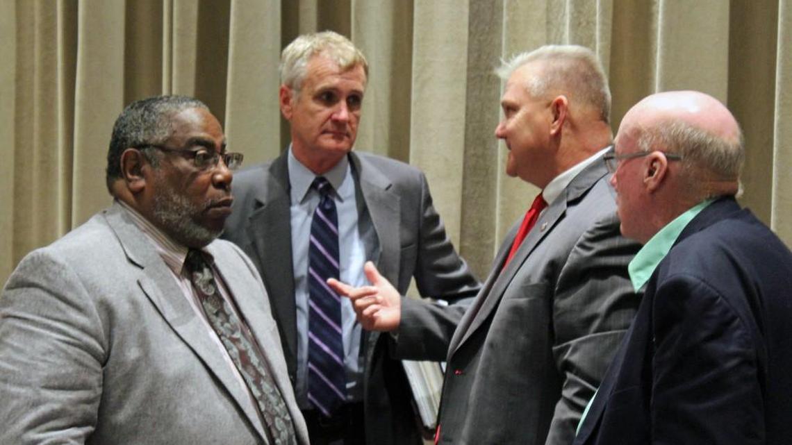 From left, Warner Robins Councilman Clifford Holmes, City Attorney Jim Elliott, Councilman Tim Thomas and Councilman Mike Davis talk after Tuesday's council meeting.