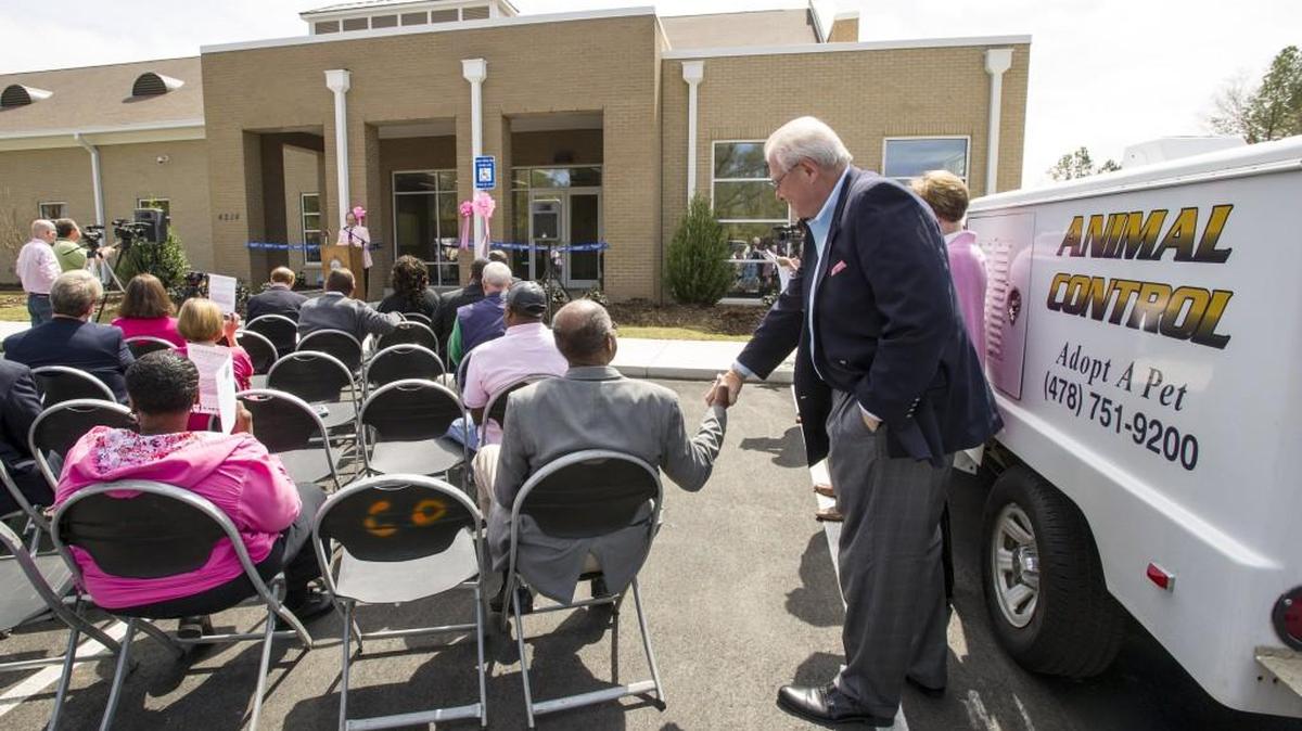Bibb County Manager Dale Walker, right, shakes hands with Commissioner Bert Bivins, III, at the Macon-Bibb Animal Welfare Shelter at the grand opening in this March 20, 2015, file photo.