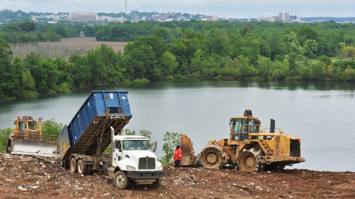 In this April 16, 2015, Telegraph file photo, crews dumping and burying garbage high above the swamps of south Bibb County may soon reach the limits of the old city landfill. The consolidated government is planning now to close the mountain of refuse the city has been using since the early 1970s.