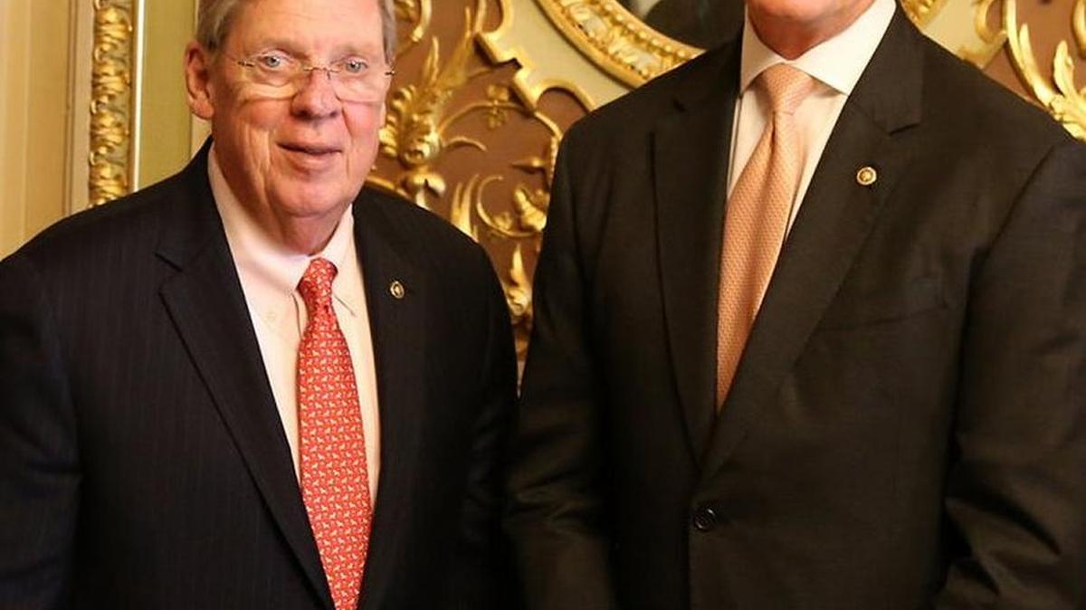 Georgia Sens. Johnny Isakson, left, and David Perdue issued statements late Thursday supporting President Donald Trump’s decision to authorize missile strikes against Syria.