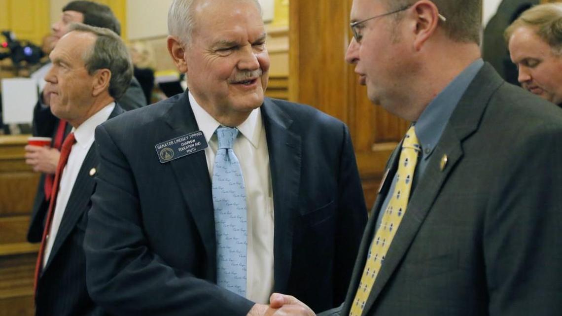 Sen. Lindsey Tippins, left, R-Marietta, congratulates Rep. Kevin Tanner, R - Dawsonville, the House sponsor of the bill, after passage of House Bill 338 on the Senate floor Friday in Atlanta. The Georgia Senate on Friday approved legislation that empowers the state to intervene in the lowest-performing schools. House Bill 338 requires that school districts authorize intervention or face financial consequences associated with the "flexibility" contracts they've signed with the Georgia Department of Education. The state House, in a followup vote on Tuesday, sent the bill to Gov. Nathan Deal for his review.