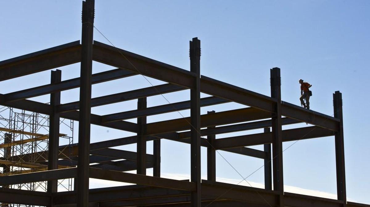 In this 2016 file photo, a construction worker walks across a piece of steel three stories up on the Spearman C. Godsey Science Center, now under construction on the Mercer University campus. For one of their classes, subcontractors in the RISE program did a walk-through of the project.