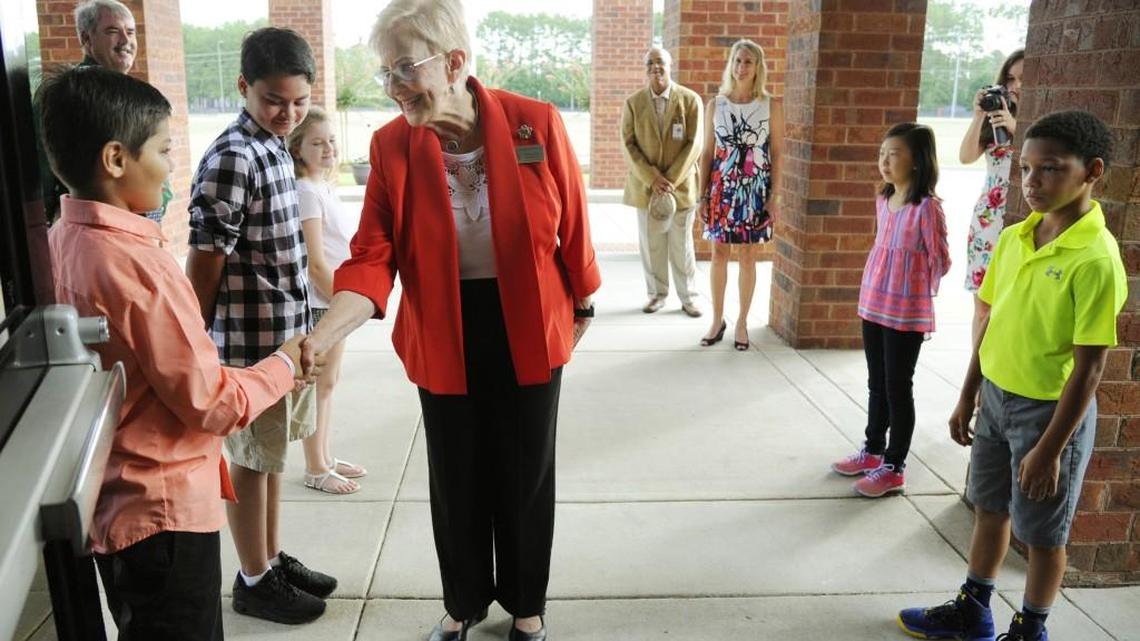 Georgia’s first lady Sandra Deal shakes hands with Lake Joy Elementary School fifth-grader Harsh Patel. Deal, visited the school in Warner Robins on Tuesday as part of a statewide campaign focusing on school bus safety. With a new school year underway, Deal is working with the Governor’s Office of Highway Safety and the Department of Education’s transportation office to educate motorists on how to drive safely as they share the roads with school buses and how to watch for children entering and exiting buses. The education campaign includes a warning that drivers who illegally pass a school bus can be cited and fined. More than 1 million children in Georgia ride a bus home from school on an average afternoon, according to information from the highway safety office.