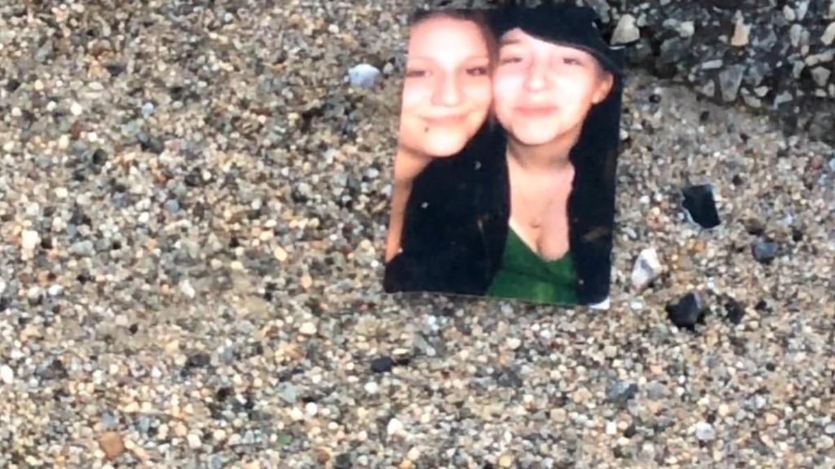 Far from the body of Amanda Phaye Burton, right, this photograph was on the side of Ga. 247 the morning she was killed on March 29, 2016.