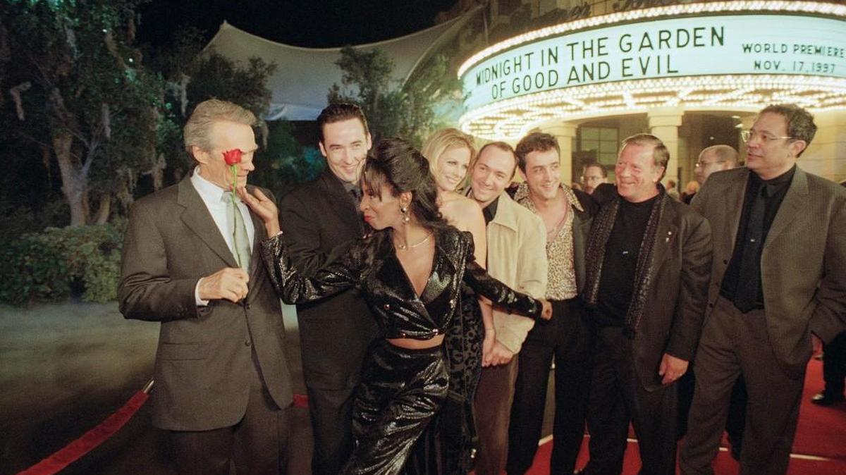The Lady Chablis, who died Thursday, visited and performed in Macon on occasion. In this picture, “Midnight in the Garden of Good and Evil” producer and director Clint Eastwood, left, is handed a rose and a loving glance by The Lady Chablis at the movie’s 1997 premiere in California.