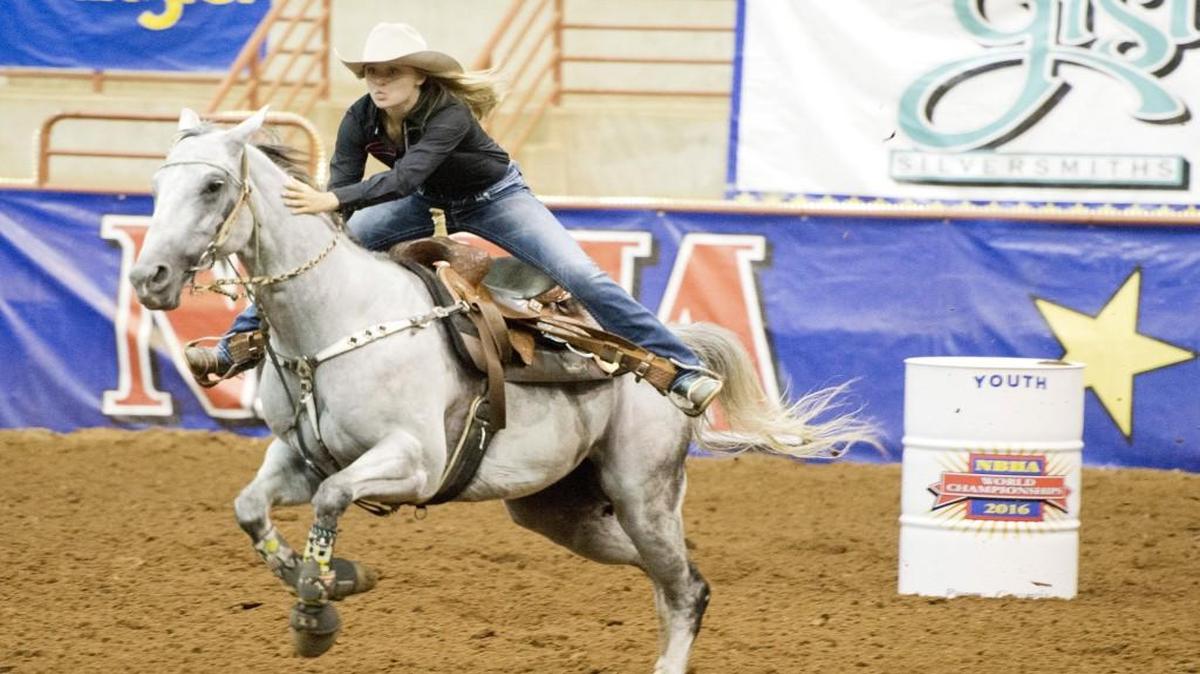 Abby Gray of Macon competes with horse, Docs's Getting Reckless, during the NBHA Youth World Championship in Perry.