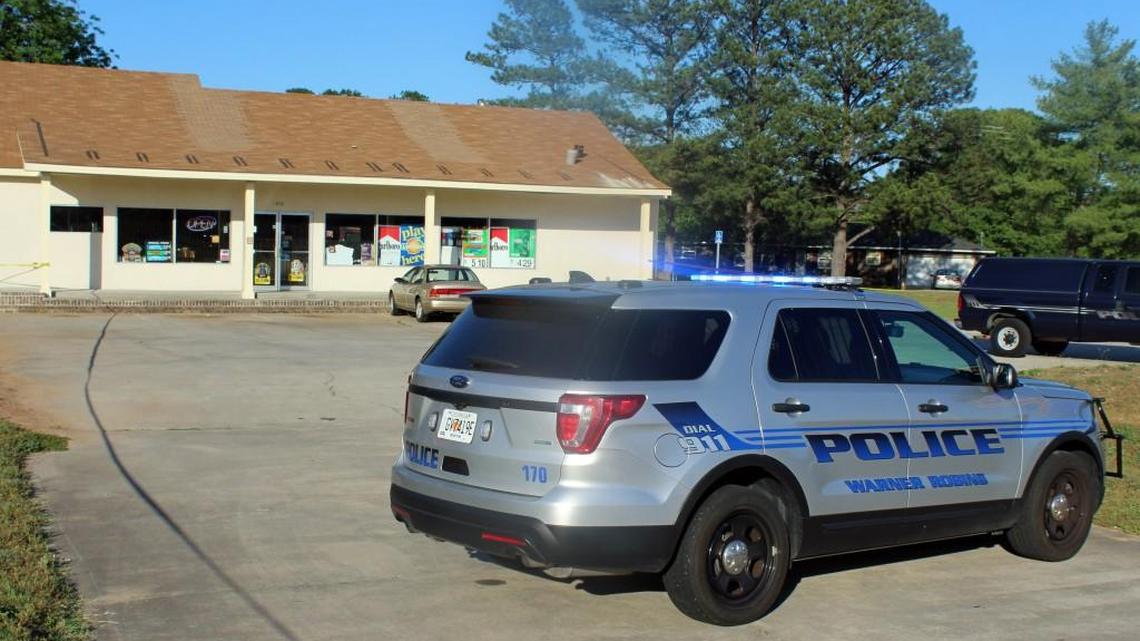A Warner Robins police vehicle blocks the entrance to Rocky's Quick Stop on Elberta Road following an armed robbery there Thursday afternoon.