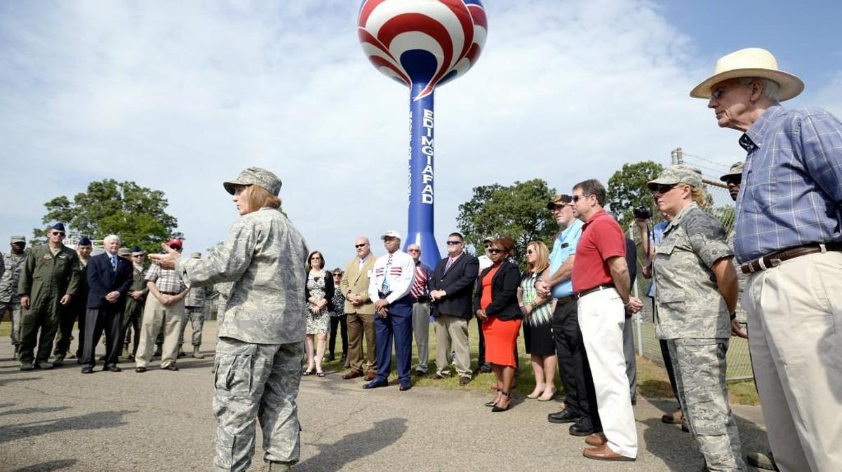 Col. Dawn Lancaster, the 78th Air Base Wing vice commander at Robins Air Force Base, speaks at a water tower design dedication Thursday morning. The 500,000-gallon water tower located along Ga. 96 was recently painted with a patriotic design.