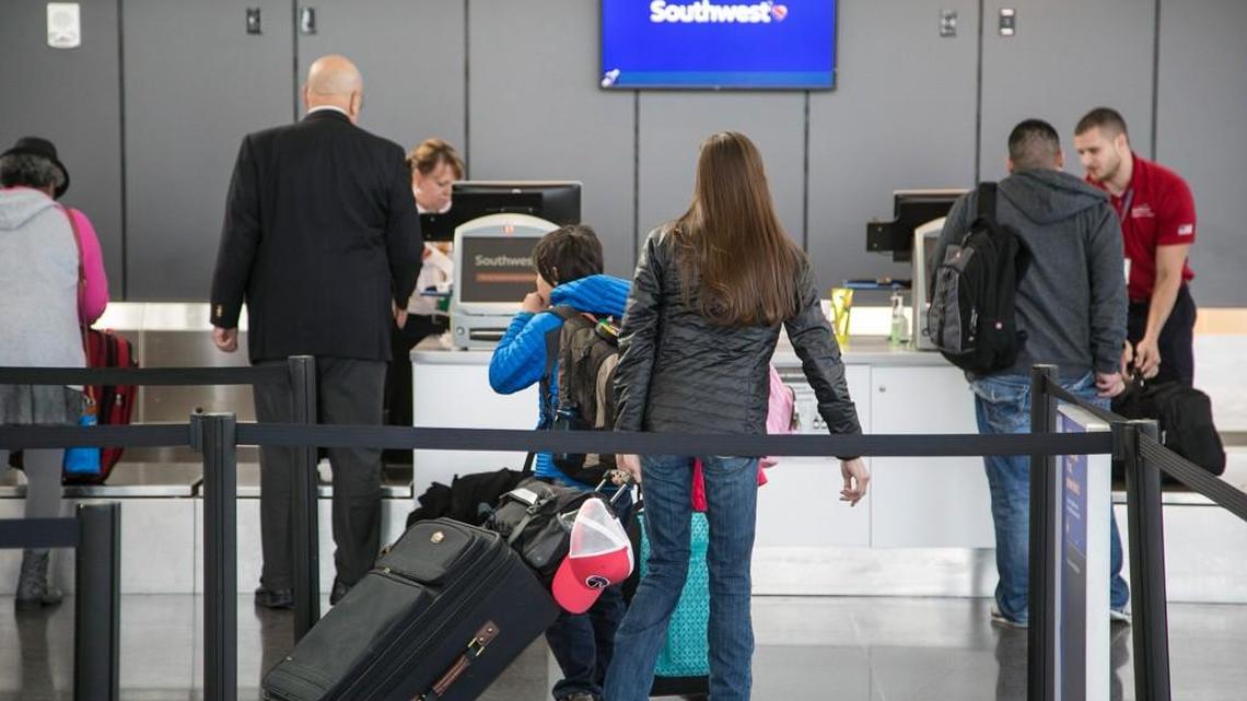 Customers at the Southwest Airlines counter at the Wichita Dwight D. Eisenhower National Airport. Southwest begins new service to Phoenix and St. Louis April 12 in lieu of to Dallas Love Field and Chicago Midway in this 2016 file photo from The Wichita Eagle.