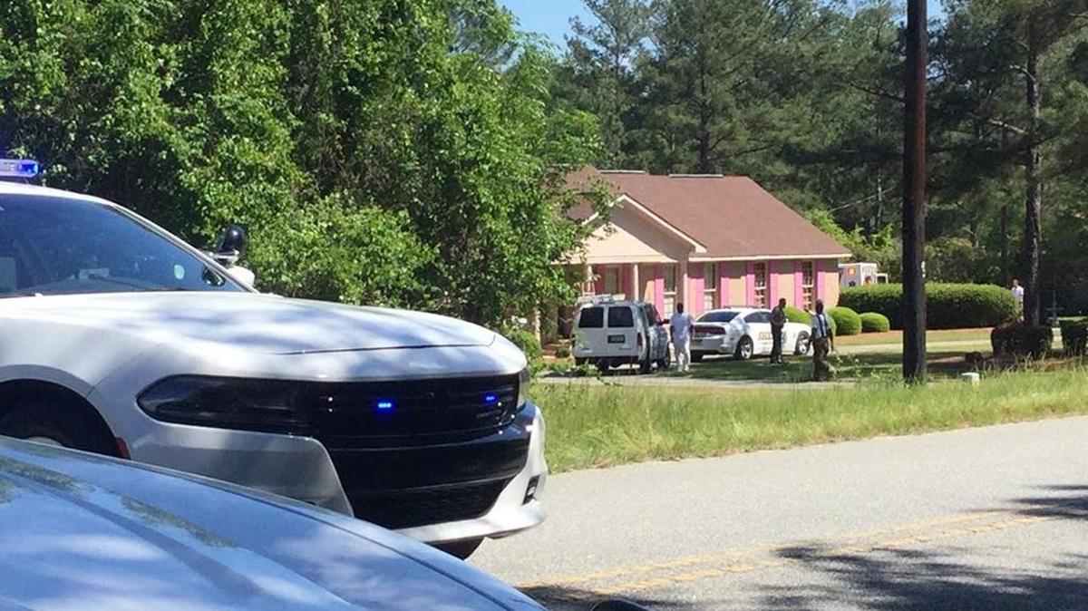 Two elderly people were assaulted at this house Tuesday afternoon on Moncrief Road in Lizella, and the suspect has barricaded himself inside, Bibb County sheriff's Cpl. Linda Howard said.