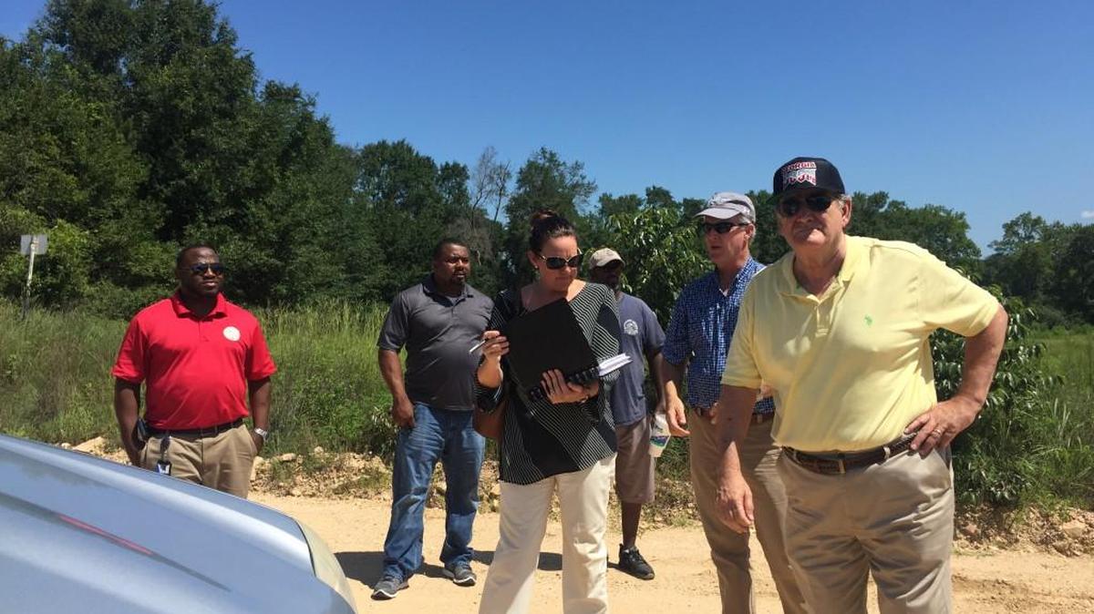 Macon-Bibb County commissioners met at West Macon Little League park to discuss renovating the site. They also visited some land in Lizella to talk about possibly adding walking trails to the area.