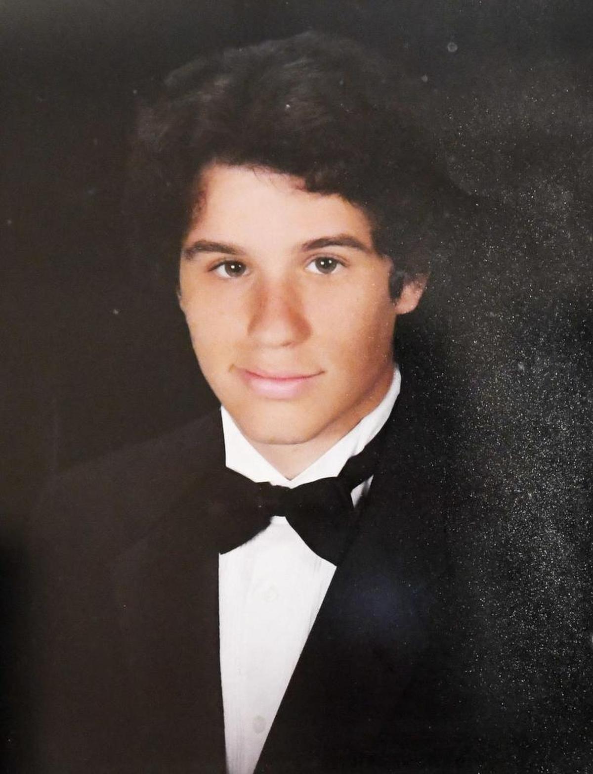 Sam Poss's senior photo hangs on the wall of grandparents’ home in Perry.