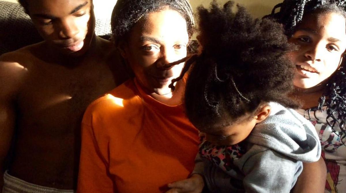 Latasha Johnson, center, with son Raleak Gilmore, 17, daughter Tiyanna Gilmore, 3, and daughter Carla Gilmore, 9.