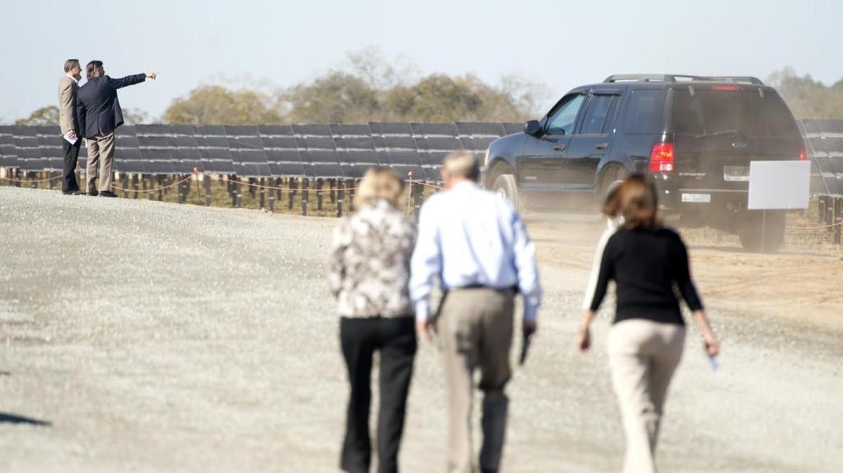 Guests look over 146-megawatt Southern Power Sandhills after a ribbon cutting ceremony for the facility in Taylor County Thursday. The facility features approximately 1.6 million of First Solar's thin-film photovoltaic solar modules.