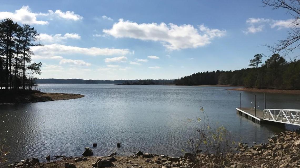 Calm waters and sunny skies are seen on Lake Juliette from the Dames Ferry Park boat dock Saturday. But earlier, three young duck hunters had to be rescued after their boat overturned in choppy waters.