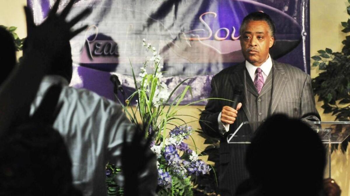 The Rev. Al Sharpton pauses in his preaching during a National Action Network membership rally at Reaching Souls Cathedral of Praise Apostolic Church.