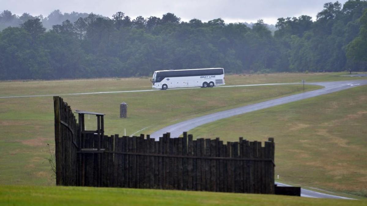 A busload of visitors to Andersonville National Historic Site on May 19 tour the grounds adjacent to the stockade where prisoners were kept during the final years of the Civil War.