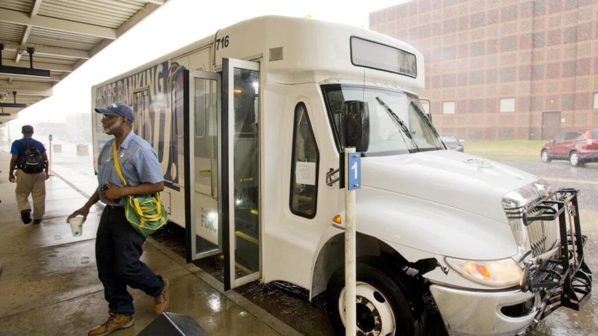 A Macon County Transit Authority bus drops off riders from the Robins Air Force Base route off at the Terminal Station on Tuesday. The route is set to end July 19 as ridership has fallen off.