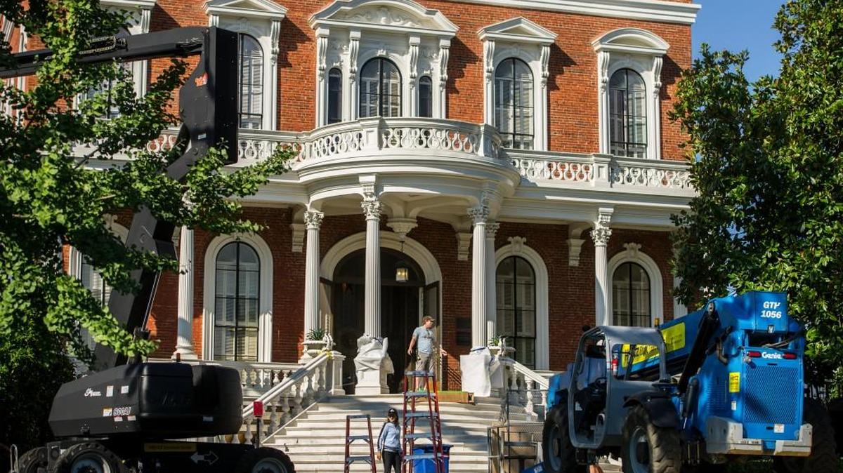 A production crew works on the Hay House grounds during filming of "The Originals" on Aug. 12, 2015.