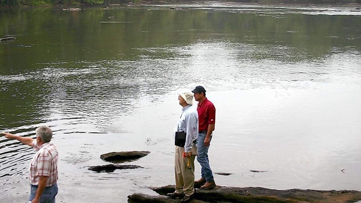 Georgia Secretary of State Brian Kemp, right, looks out at the Ocmulgee River, where Bibb and Monroe county officials showed him areas of significance in a long-running border dispute.