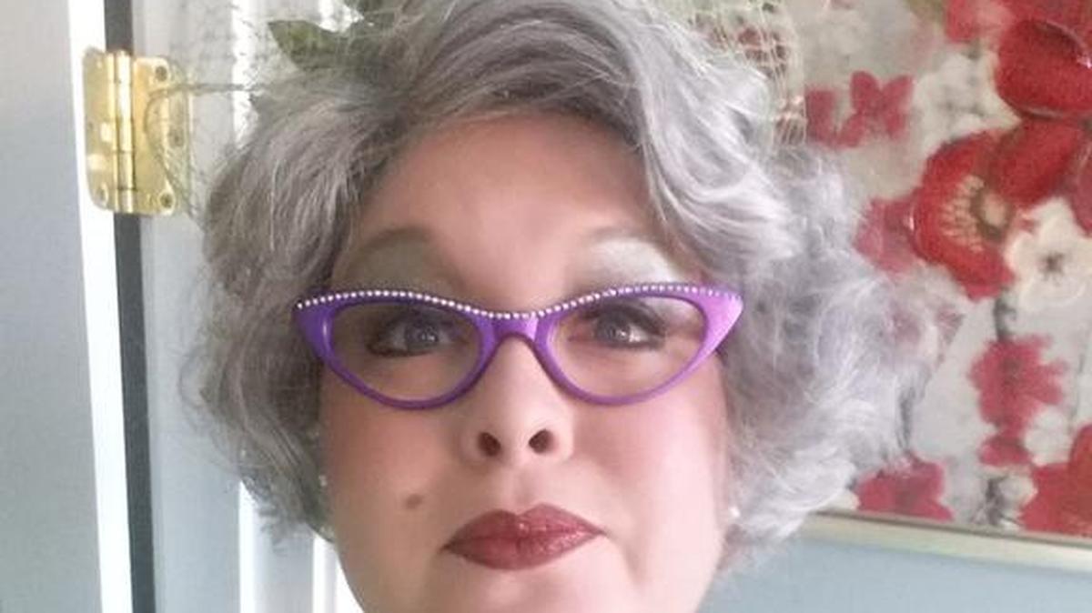 Julie McAfee is shown in character as Miss Manners.