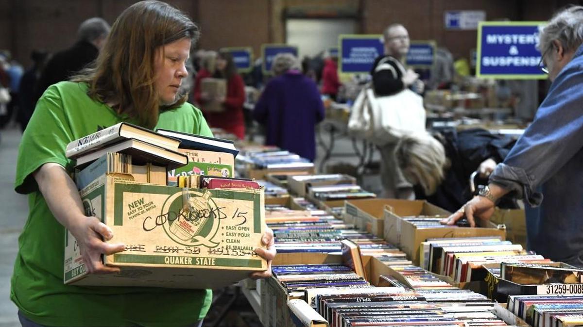Leah McEwen of Albany filled a box with books to buy at 2017 the Friends of the Library Old Book Sale.