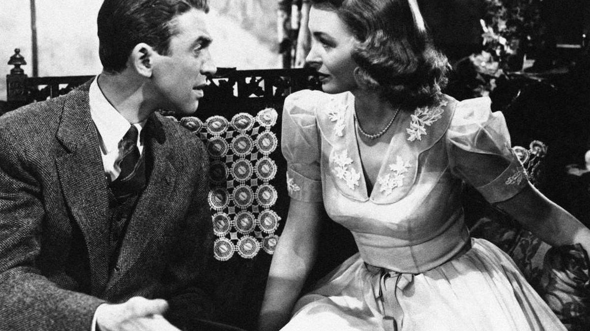Jimmy Stewart explains things to Donna Reed in “It’s a Wonderful Life” 1946.