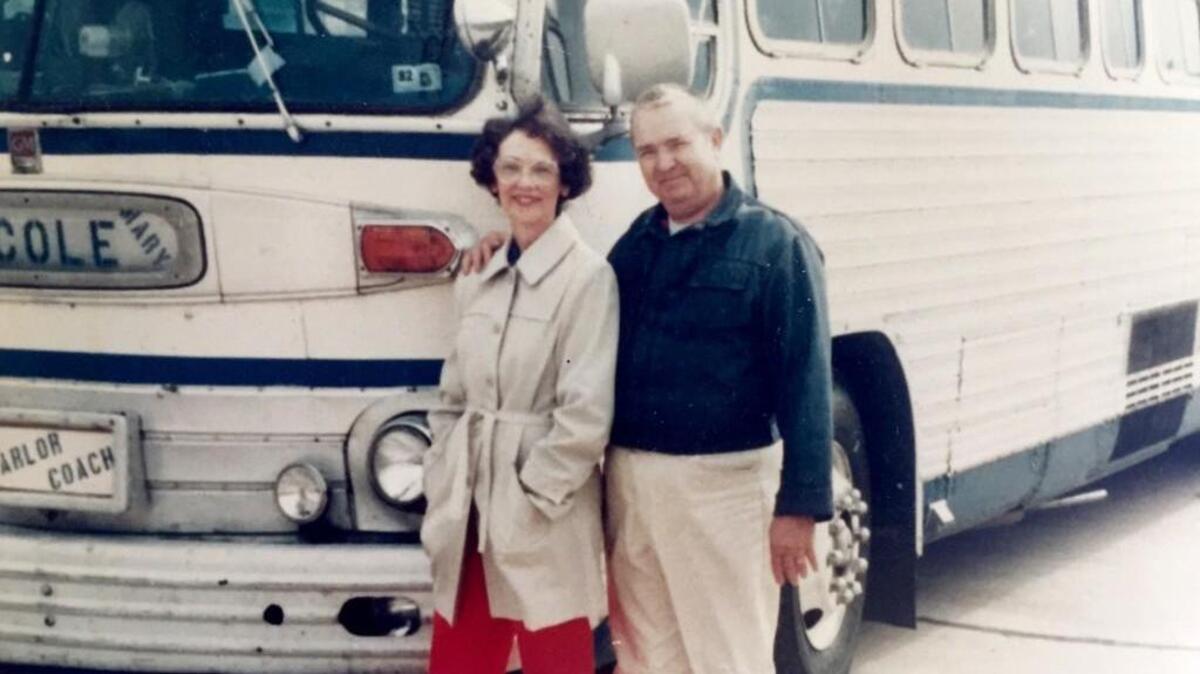 Robert and Earline Cole, of Bonaire, stand beside “Parlor Coach,” a bus the Coles converted into camper, as they prepare to head home from Fort Worth, Texas, in 1982.