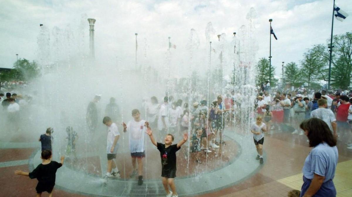 Children play in the splash pad at Centennial Olympic Park for the first time since a bomb exploded killing one person and injuring more than 100 on July 27, 1996.