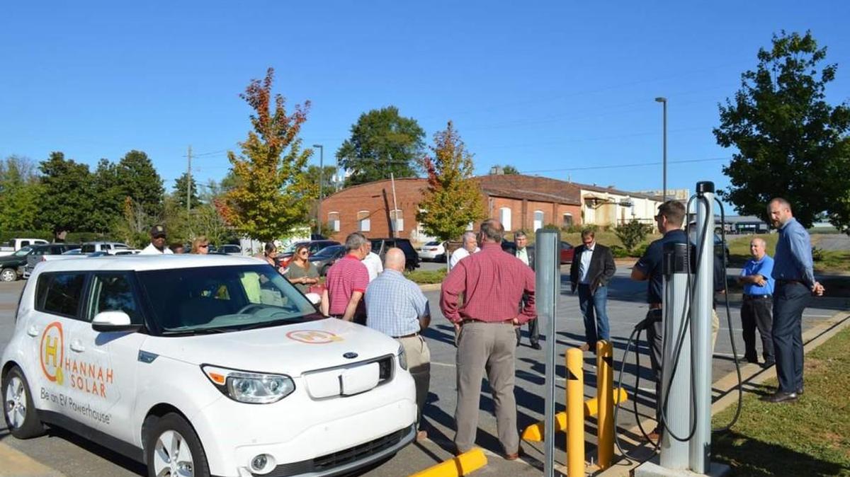 A ceremony was held Thursday for a new electrical vehicle charging station in Forsyth, located in a parking lot next to the police station on South Kimball Street.