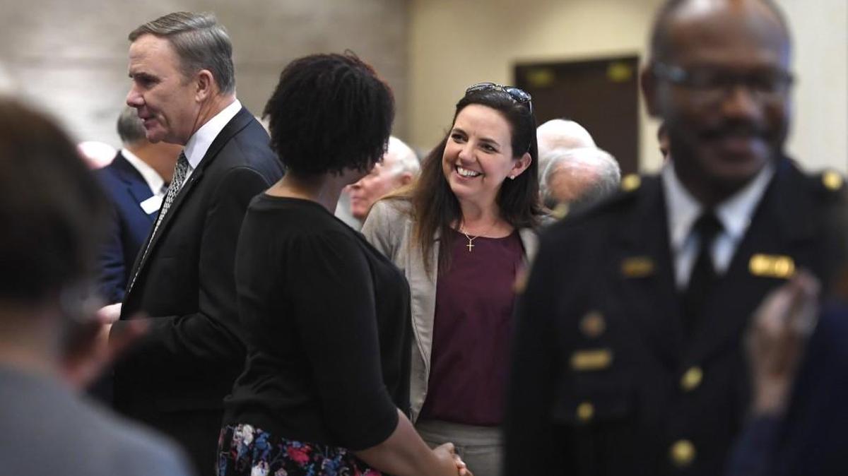 Julie Moore with Macon-Bibb County mingles in the crowd before the State of the Community program begins Feb. 16.