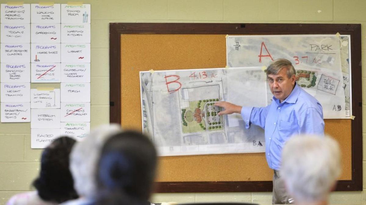 Landscape architect Mack Cain talks with about a dozen people at North Macon Park interested in the location of a new senior center in this Sept. 23, 2015, Telegraph file photo.