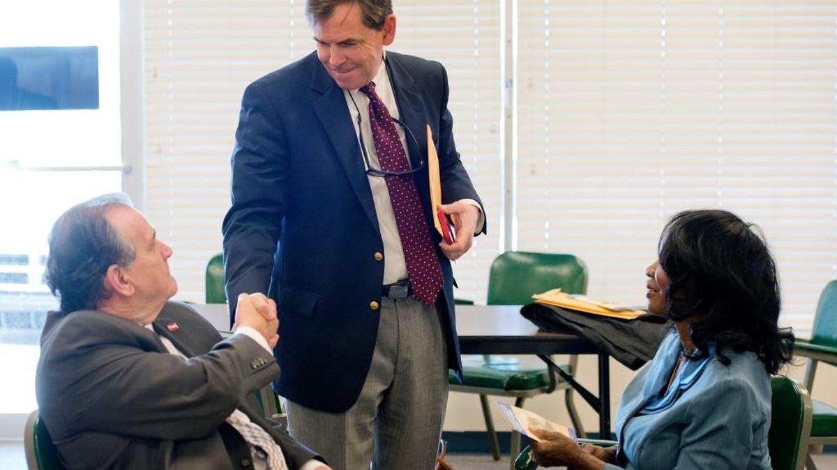 Macon-Bibb County Commissioner Gary Bechtel greets former commissioner Joe Allen at the Bibb County Board of Elections office on March 7, 2016.