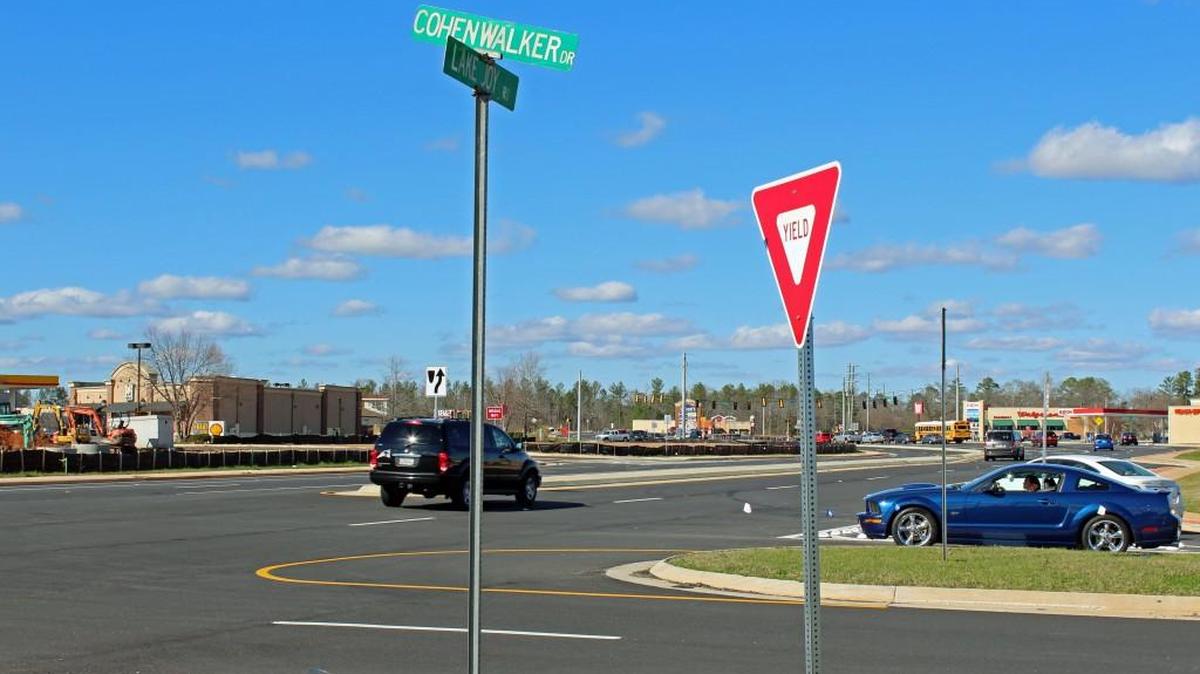 Traffic moves through the intersection of Lake Joy Road and Cohen Walker Drive. Construction on a new traffic signal is expected to begin in a few weeks.