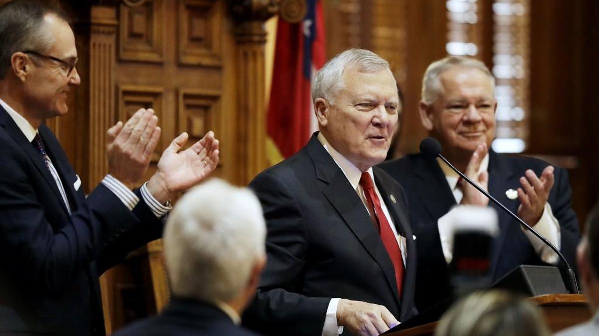 Georgia Gov. Nathan Deal steps to the podium to deliver the State of the State address on the House floor at the state Capitol on Wednesday. Deal is asking lawmakers to permanently authorize over-the-counter sales of an opioid reversal drug.