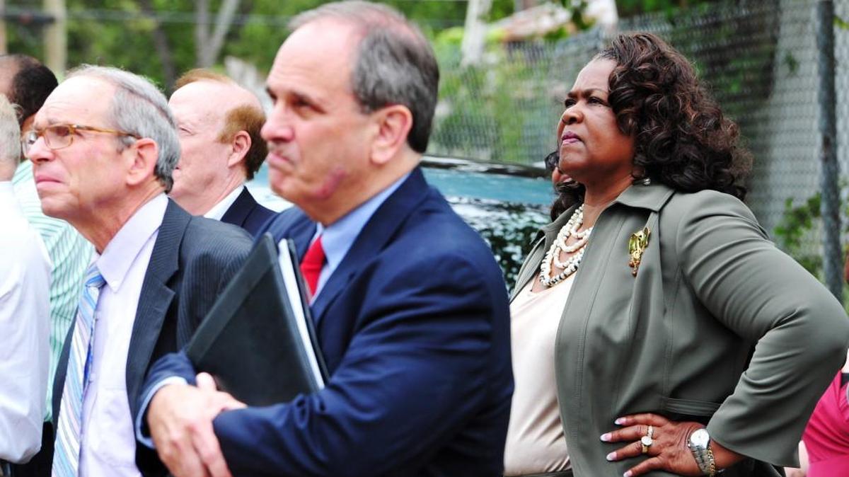 Macon-Bibb County Commissioner Elaine Lucas, Mayor Robert Reichert and Commissioner Larry Schlesinger watch as a public works crew demolishes an abandon house on 09/30/2014.