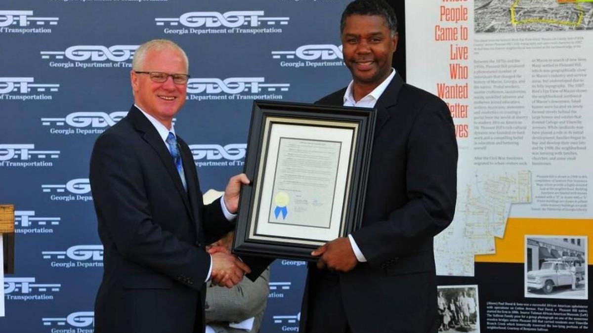 State Sen. James Beverly, right, was presented in June a Georgia State Transportation Board resolution for his efforts in leading the Pleasant Hill mitigation as part of the I-75 and I-16 construction project. Beverly was also named this summer as chair of the Georgia House of Representatives Democratic Caucus.