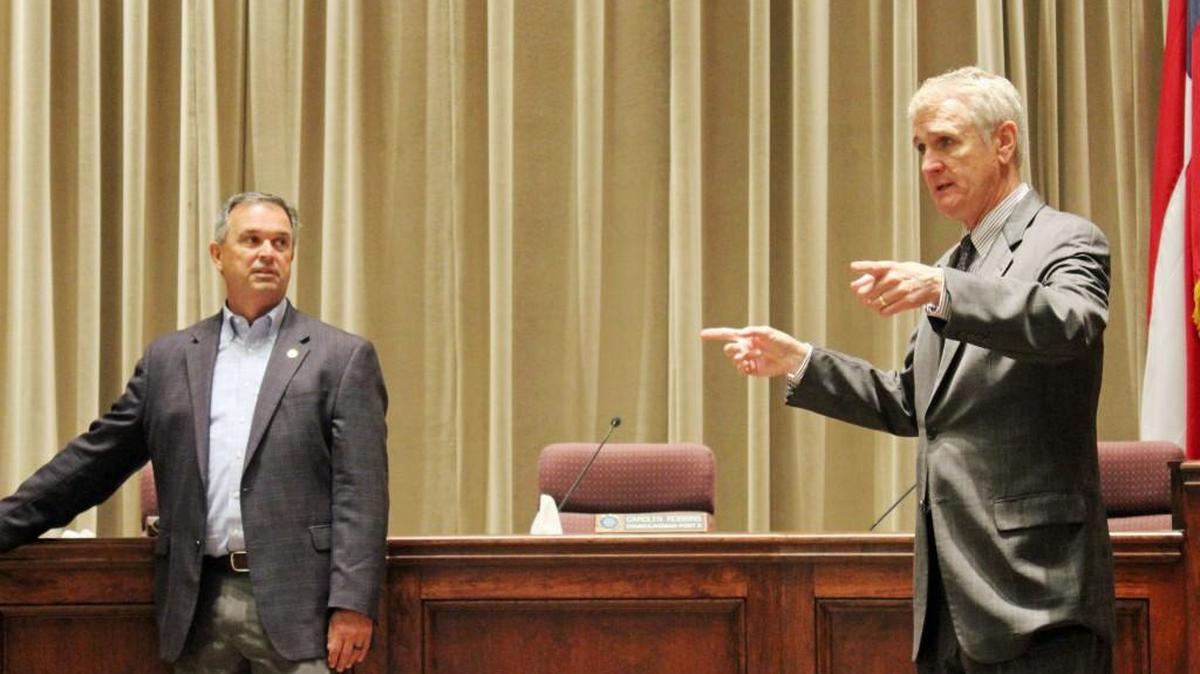 Warner Robins City Attorney Jim Elliott, right, speaks to high school students at City Hall on Thursday as Mayor Randy Toms listens. Elliott has been nominated to the Georgia Municipal Association Hall of Fame.