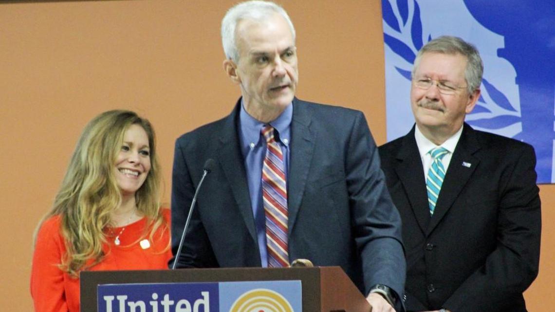 Jeff Battcher, center, was awarded the Lt. Randy Parker Volunteer of the Award by the United Way of Central Georgia on Thursday. Looking on is Parker's wife, Sandie, and George McCanless, president of the local United Way chapter.