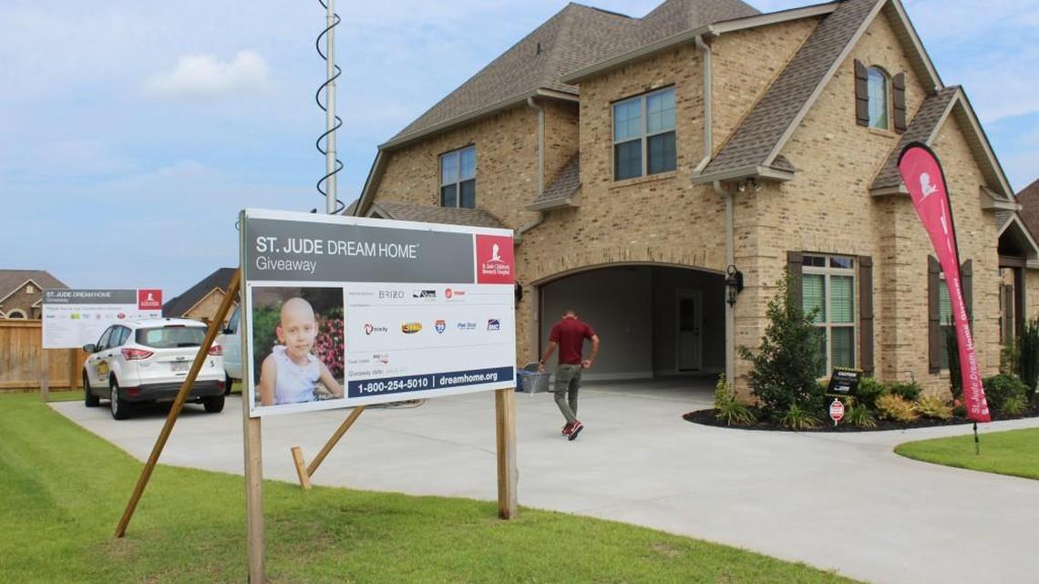 Hilda Dukes of Roberta on Sunday won this house in Warner Robins in a raffle to benefit the St. Jude Children's Research Hospital.