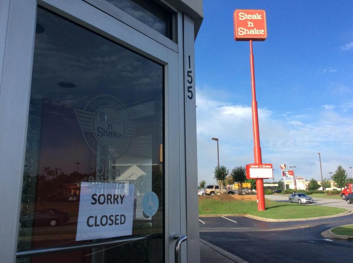 A “Sorry Closed” sign hangs on the door of the Steak n’ Shake on Tom Hill Sr. Blvd. The restaurant closed in 2017.