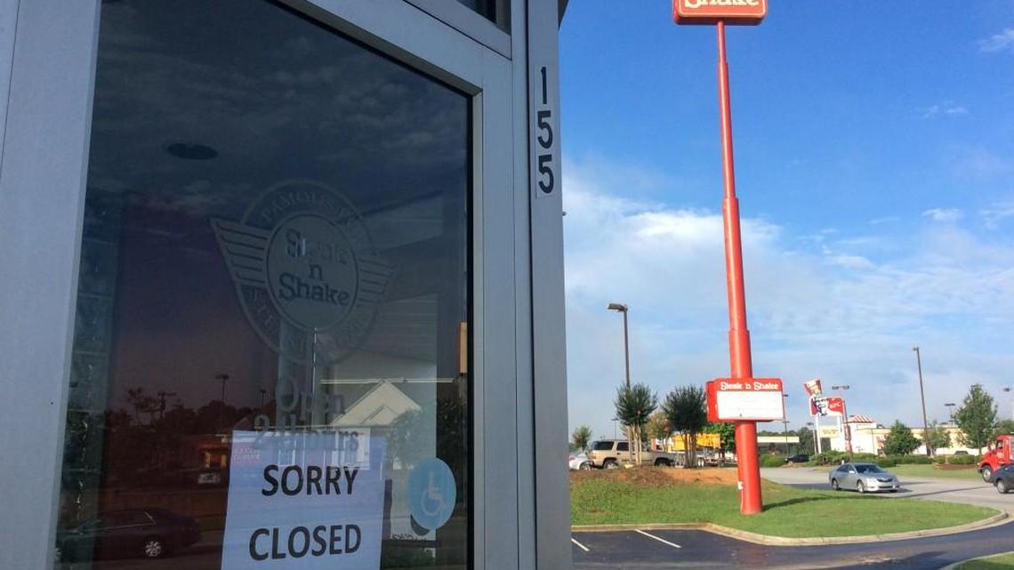 A "Sorry Closed" sign hangs on the door of the Steak n' Shake on Tom Hill Sr. Blvd. Friday morning.