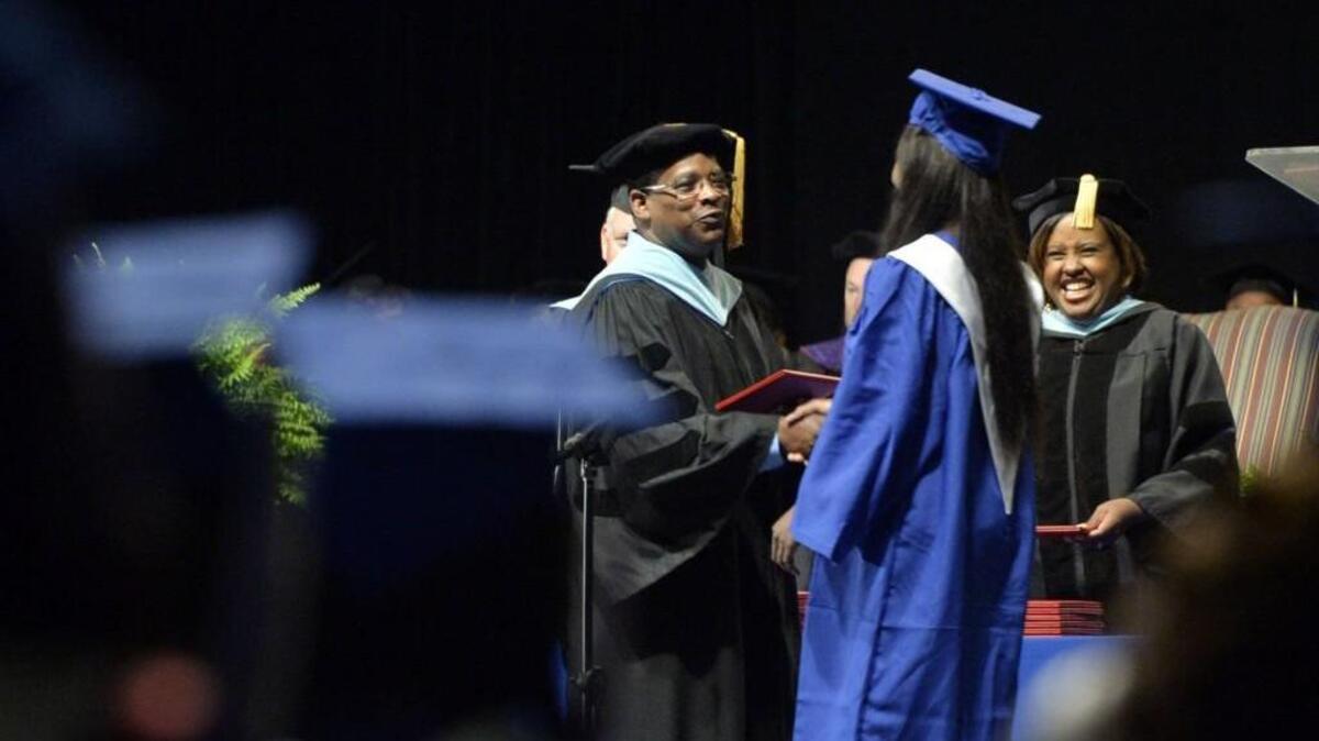 Bibb County schools Superintendent Curtis Jones congratulates graduates as he passes out diplomas May 28 at the Southwest High School graduation at the Macon Coliseum.