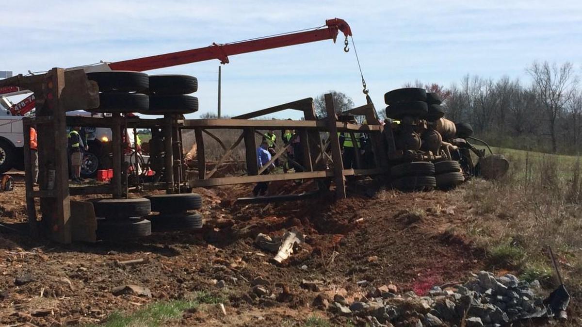An overturned logging truck at the scene of Thursday’s fatal crash north of Gray.
