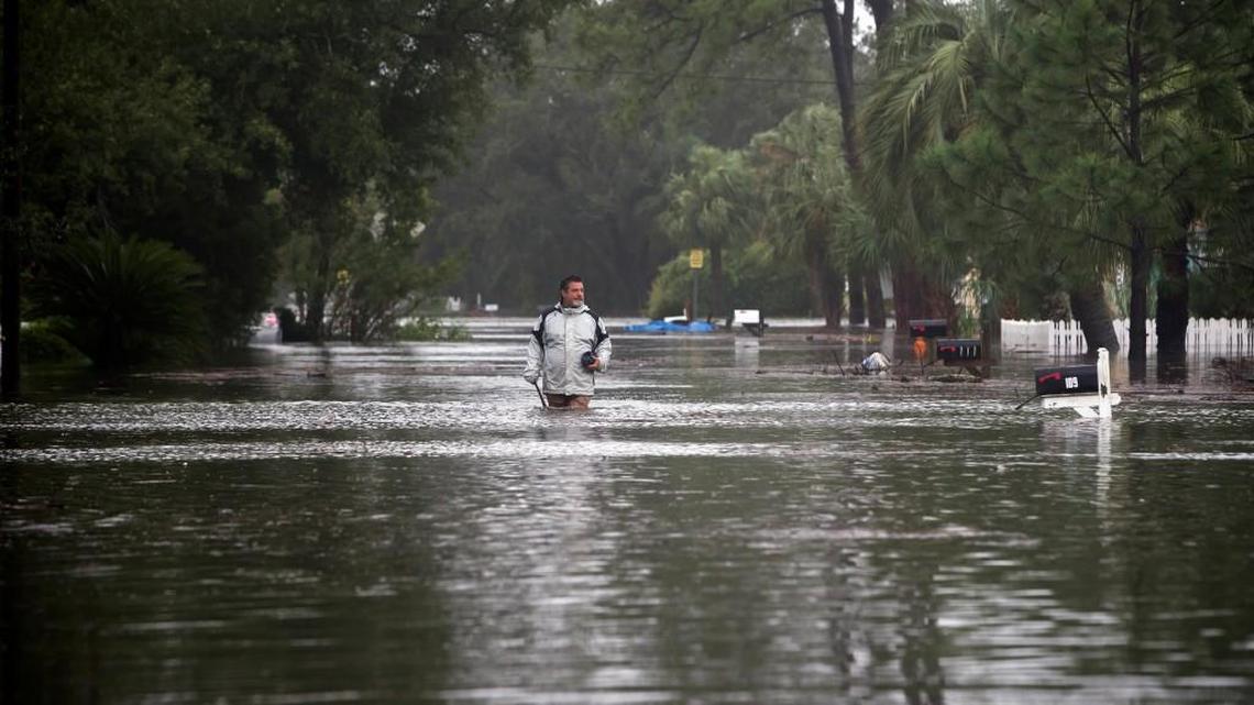 Joey Spalding walks back to his truck on Tybee Island after Tropical Storm Irma brought three feet of storm surge into his living room.
