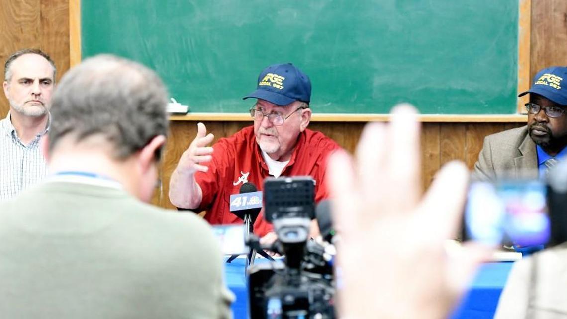 Ray Van Schoubroek, American Federation of Government Employees Local 987 trustee, speaks at a news conference Jan. 30 to discuss the federal hiring freeze. Along with him is steward David Tucker, left, and Marion Williams, who was interim president at the time.