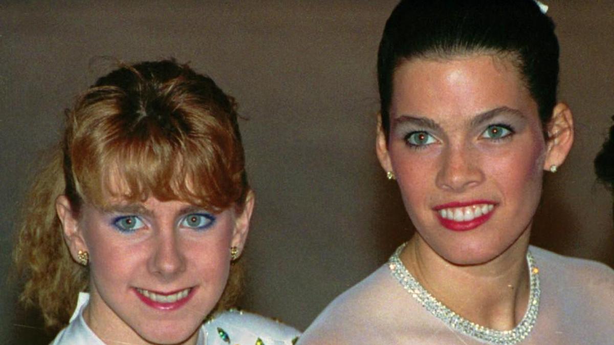In this Jan. 12, 1992, file photo, Tonya Harding, left, and Nancy Kerrigan appear at the U.S. Figure Skating Championships in Orlando, Fla. It's been nearly 20 years since Kerrigan was clubbed after practice in Detroit by a member of a bumbling goon squad hired by Harding's ex-husband with the hope of eliminating his former wife's top competition for the U.S. Olympic team. (AP Photo/Phil Sandlin, File)
