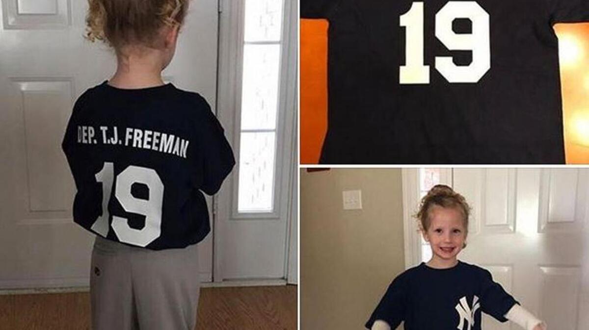 Madison Ryan, 4, models her Yankee uniform for the Crawford County Wee Ball league that bears the name of the late Bibb County sheriff’s deputy T.J. Freeman.
