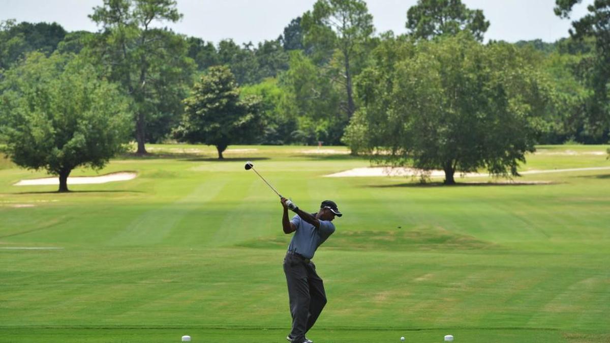 Antonio Harris tees off on the sixth hole at Bowden Golf Course in this Aug. 9, 2013, file photo.